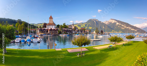 Panorama with Spiez Church and Castle on Lake Thun in Swiss canton of Bern, Spiez, Switzerland. photo