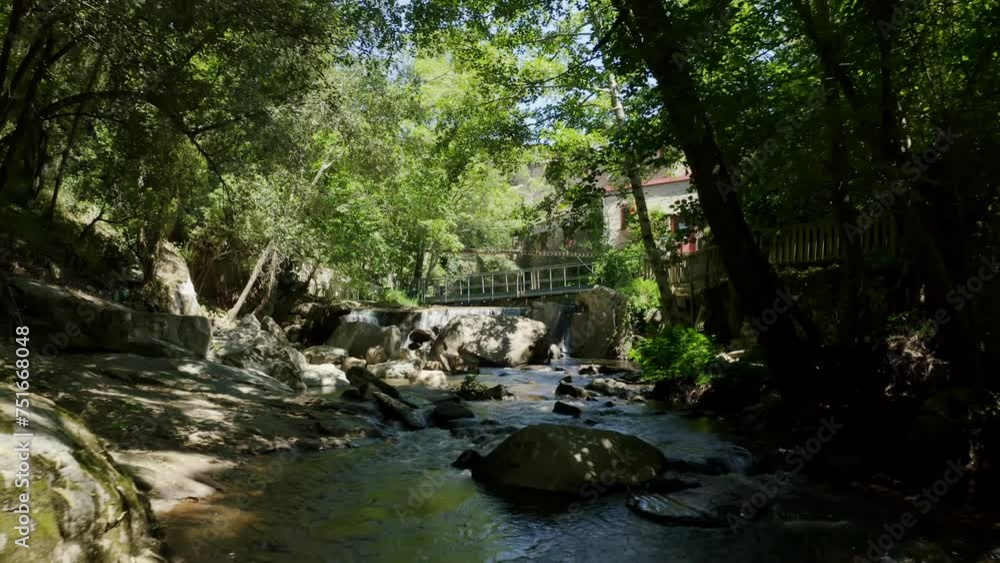 Aerial shot of an operational paper mill in the Black Mountain, north of Carcassonne, in the small village of Brousses et Villaret. Seen from a shaded path alongside a small stream.