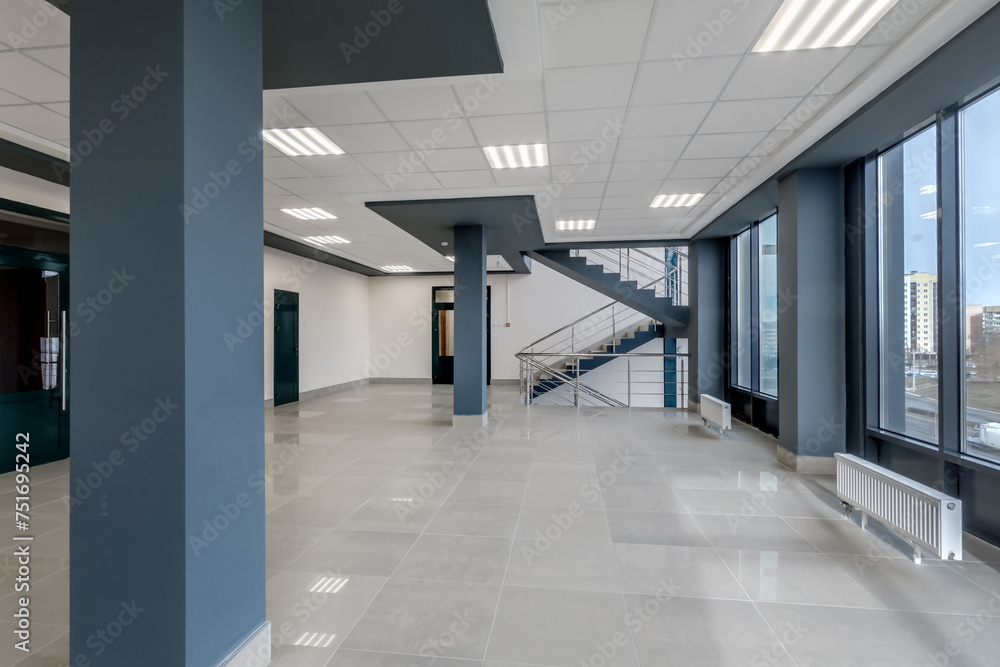 empty hall room with columns, doors and panoramic windows in modern office empty hall room with columns, doors and panoramic windows in modern office