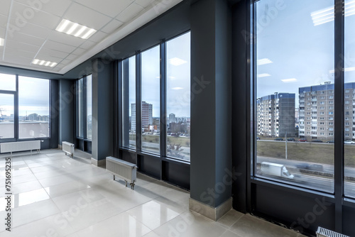 empty hall room with columns  doors and panoramic windows in modern office