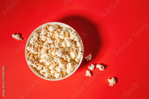 Popcorn isolated on bright yellow background, movie night