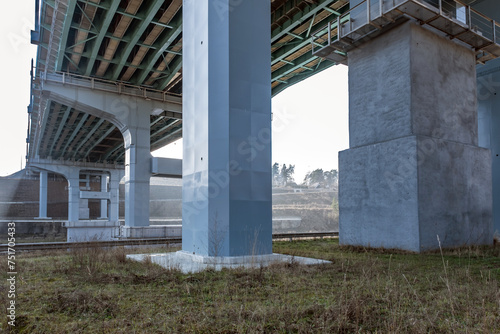 steel frame and concrete construction huge car bridge across the wide river © hiv360