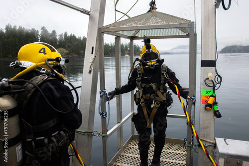 Commercial divers entering deep water for work