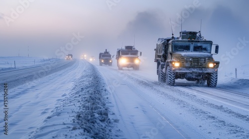 A column of armored personnel carriers riding on a winter road, exemplifying military readiness and strategic winter operation.