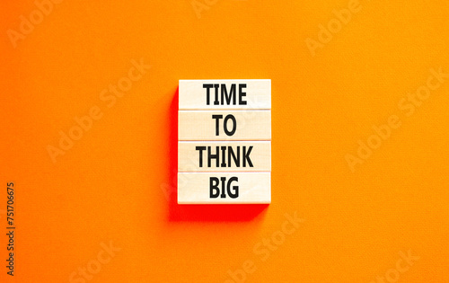 Time to think big symbol. Concept words Time to think big on beautiful wooden block. Beautiful orange table orange background. Business and time to think big concept. Copy space.