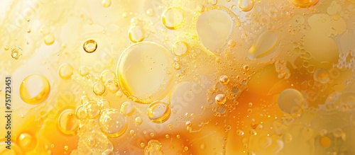 In this macro shot, water droplets are prominently displayed against a bright yellow backdrop. The droplets appear crystal clear and reflective, capturing the essence of purity and simplicity.