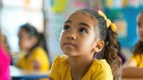 Young Girl Looking Up Thoughtfully in Classroom Setting with Diverse Students in Background