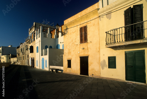 Fototapeta Naklejka Na Ścianę i Meble -  street in the town, Houses along the ramparts in Alghero. Sassari, Sardinia. Italy