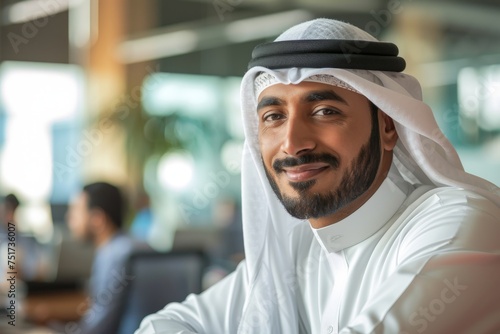 Content Emirati Arab professional in Kandura at work perfect for Middle Eastern business image