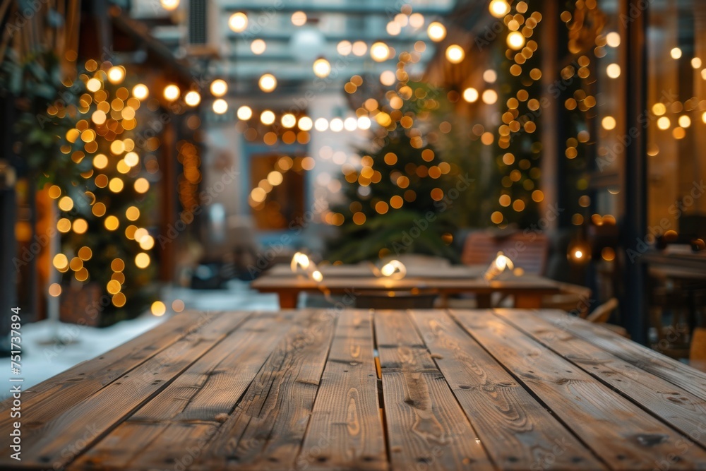Empty wooden table with abstract warm living room decor and Christmas tree lights in background Perfect for holiday displays