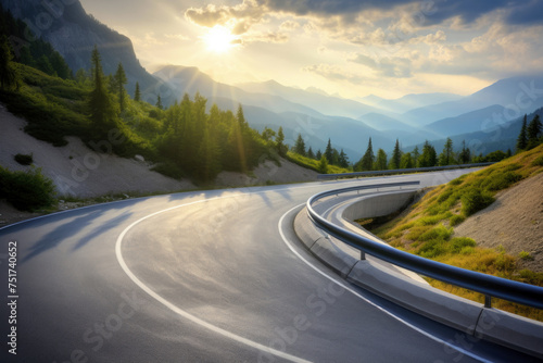 Winding mountain road with the sun peeking through the clouds. High quality photo