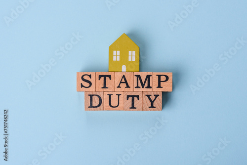 The inscription Stamp Duty made of wooden cubes on a plain background photo