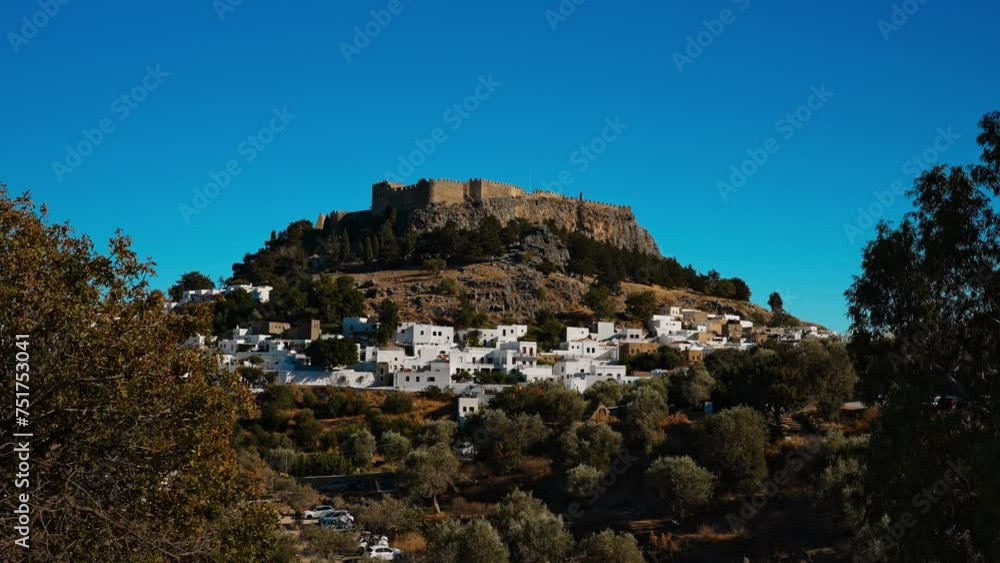 The majestic Lindos Acropolis and old town. The majestic Lindos Acropolis and old town.