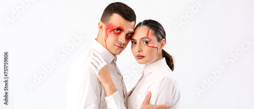 Young couple with painted f...