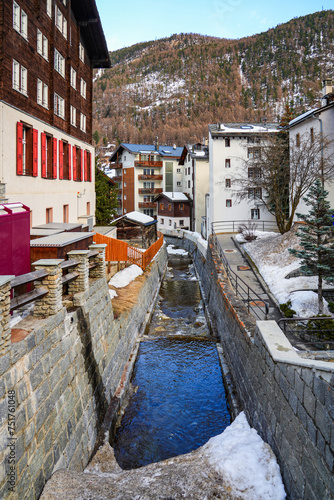 Canal of glacial melt water in the luxury car-free ski resort of Zermatt in the Canton of Valais, Switzerland