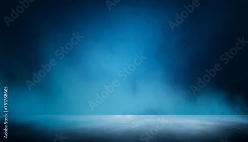 abstract background with blank dark wall and smoky concrete floor illuminated by blue color mockup
