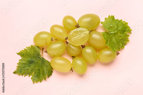 Fresh green grapes with lea...