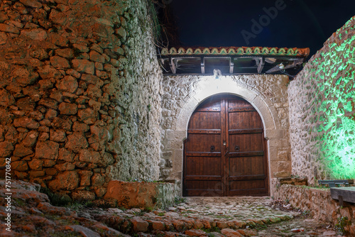 Old door in stone wall inside  Kruje castle in Albania  photo