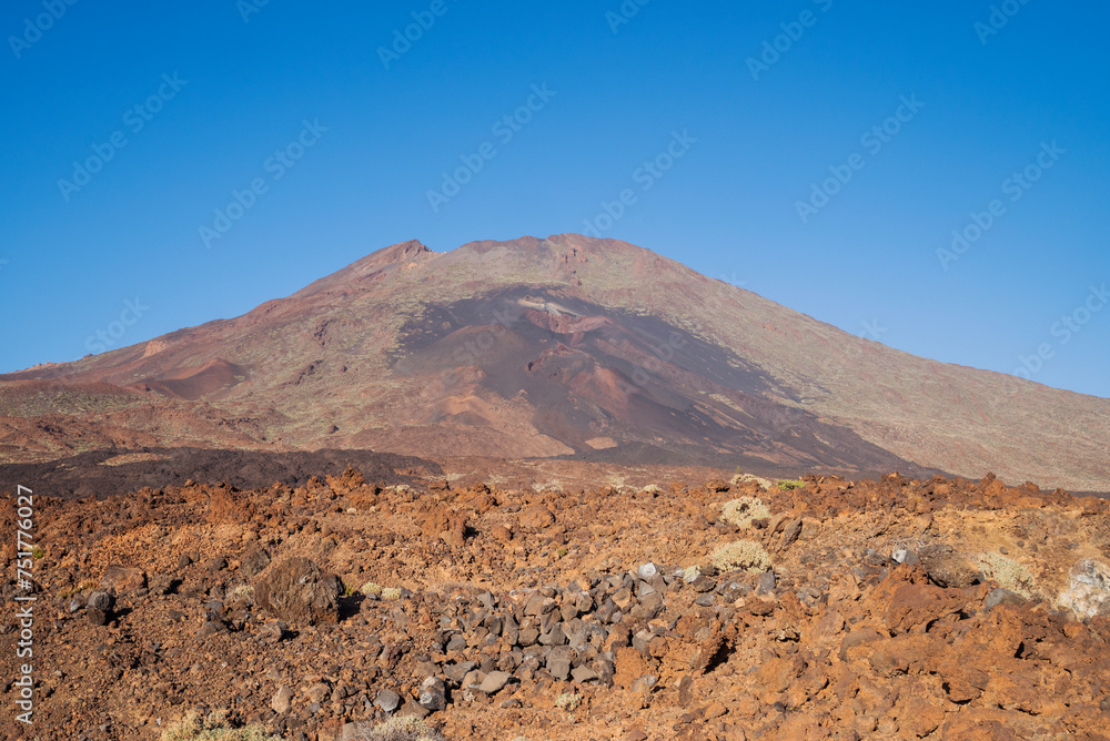 Cosmic landscapes with lava stones in the Teide Volcano National Park in the Canary Islands, view of the top of the mountain