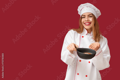 Happy young female chef sho...
