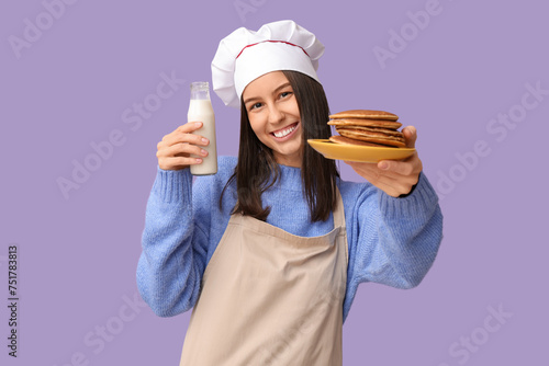 Young female chef with tast...