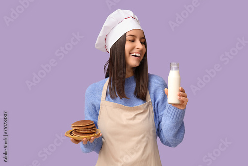 Young female chef with tast...