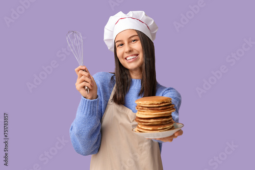 Young female chef with tast...