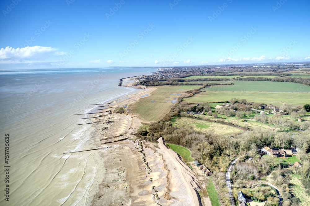 Aerial view of Atherington and Climping beach in West Sussex and the broken sea defence and the temporary shingle bank in place to protect the land.
