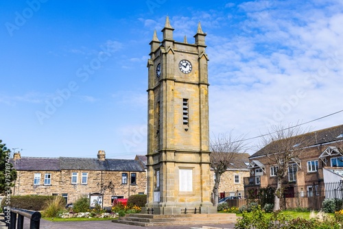 Clock tower in a square in Amble. photo