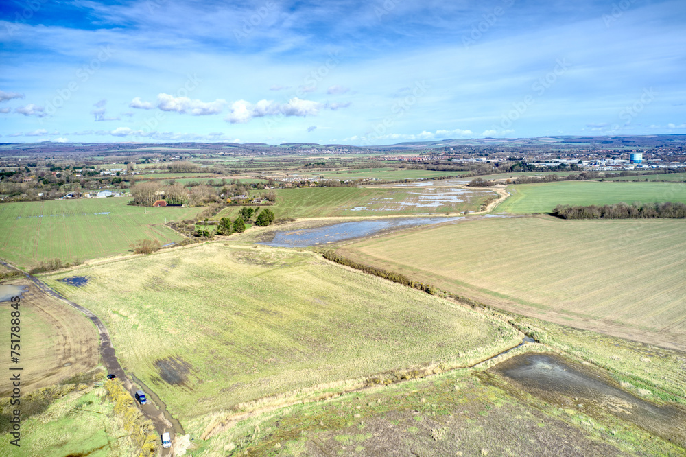 Aerial photo of the West Sussex countryside after heavy rainfall at Atherington and Climping beach.
