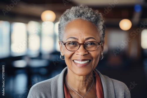 Portrait of a smiling senior African American woman in a library