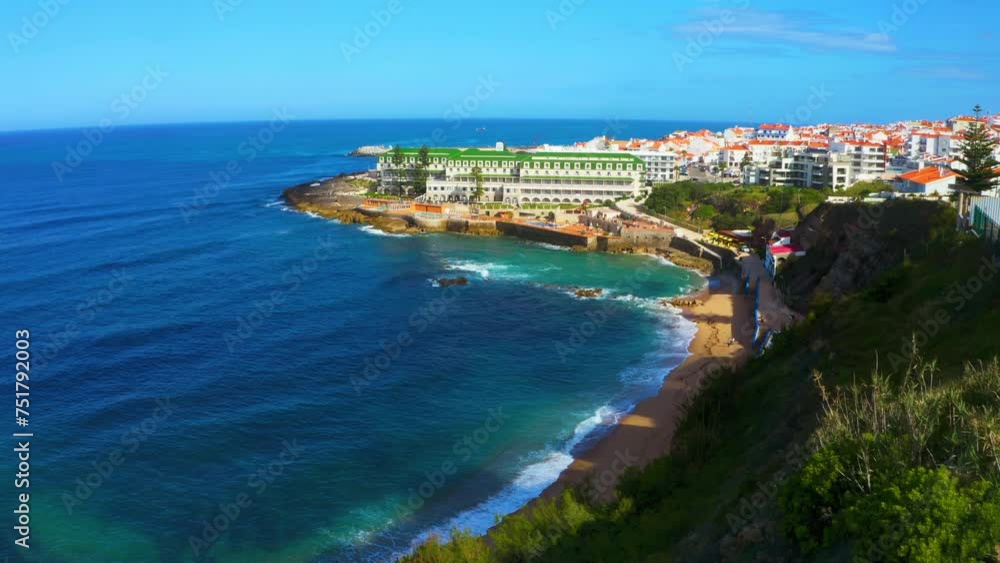 Beautiful sandy beach Atlantic ocean on summer sunny day in touristic city Ericeira. Aerial view - Popular beach for tourists while summer vacation. Drone view of scenic nature place of Portugal. Beautiful sandy beach Atlantic ocean on summer sunny day in touristic city Ericeira. Aerial view - Popular beach for tourists while summer vacation. Drone view of scenic nature place of Portugal.