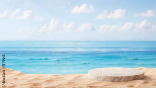 Marble podium in tropical sand over blurred tropical sea background © adynue