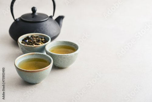 two ceramic cups of green tea