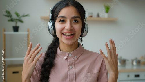 Webcam view smiling Arabian girl in headphones happy ethnic indian woman businesswoman student talking to audience video conference call online lecture webinar from home distance education quarantine