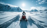 An adventurous person snowmobiling through a vast, snow-covered mountains