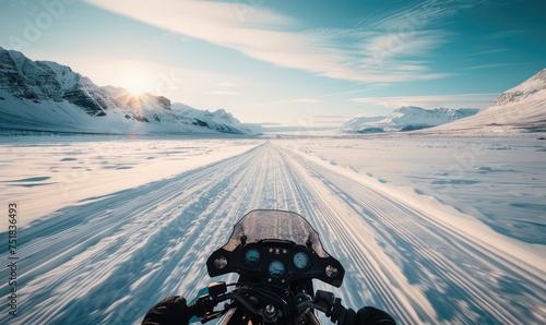 An adventurous person snowmobiling through a vast, snow-covered mountains