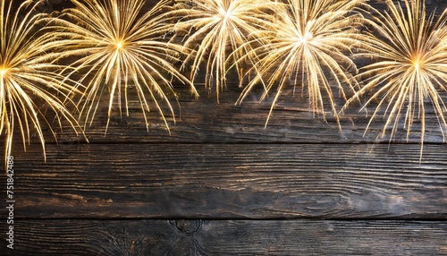 illuminate your designs with the magic of silvester 2024 golden fireworks and bokeh lights on rustic black wooden texture an enchanting choice for greeting cards and event backgrounds