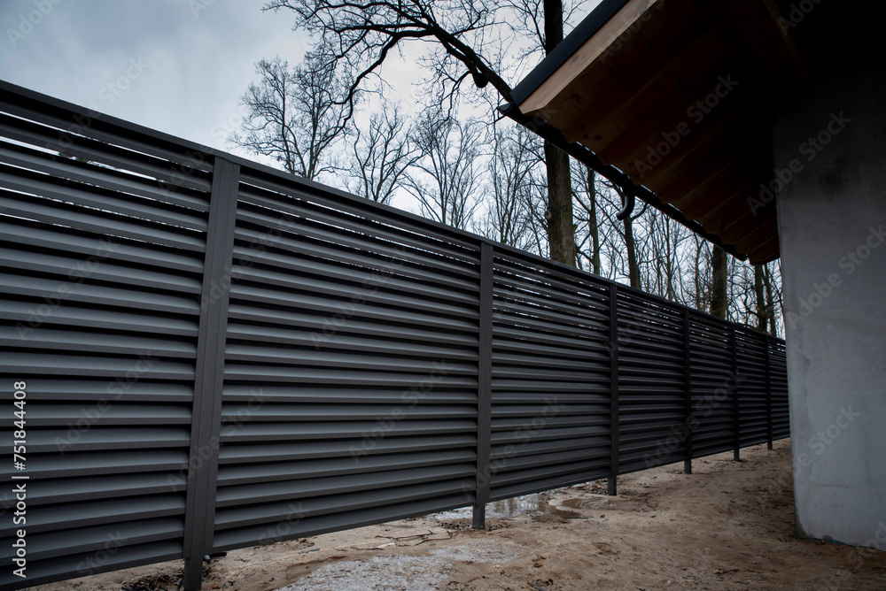 Fototapeta premium Modern metal fence with shutters