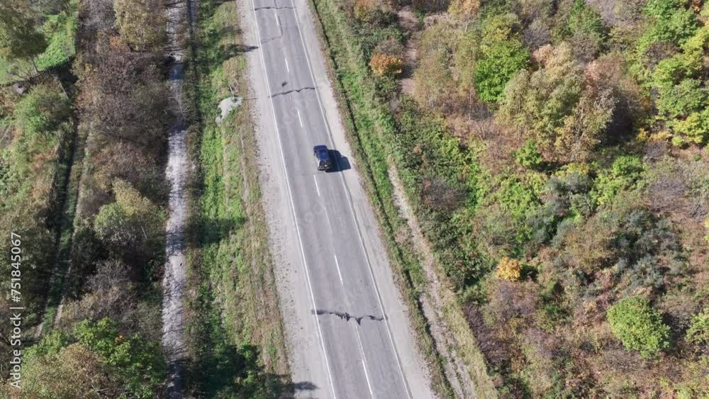 Aerial View of Car Driving Down Road Aerial View of Car Driving Down Road