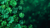 A close-up of vibrant green clovers with a deep, bokeh-effect background, capturing the lushness and luck associated with this iconic plant