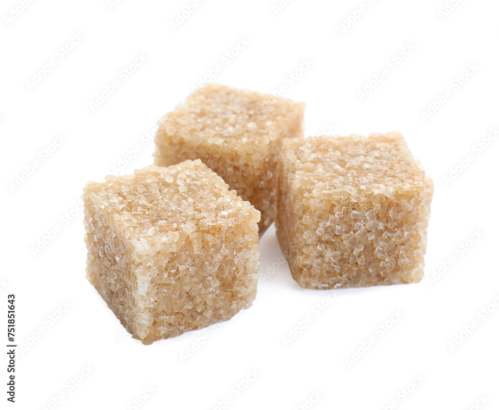 Three brown sugar cubes isolated on white Three brown sugar cubes isolated on white