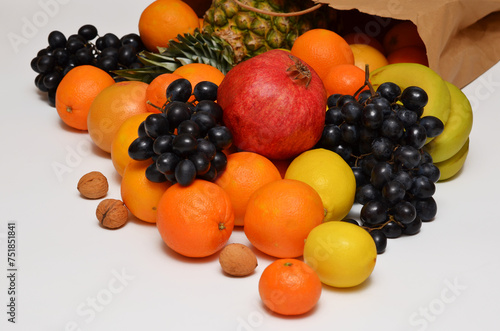 different types of tropical fruits and paper bag  fresh food delivery