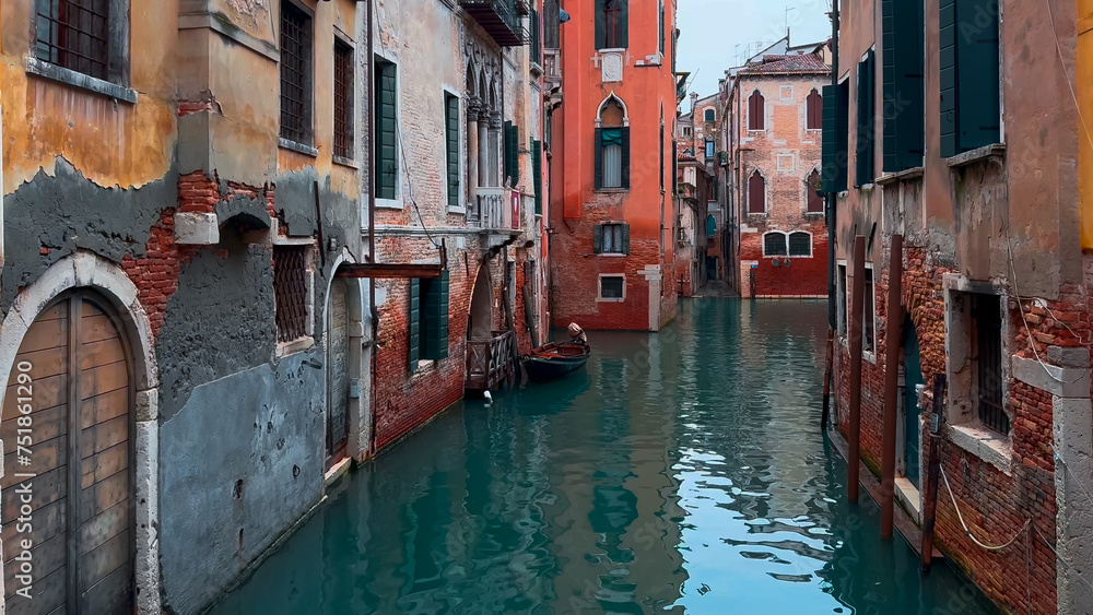 Medieval houses, narrow canals, bridges, gondolas in Venice, Italy, February 10, 2024. High quality 4k footage