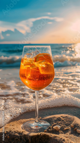 Refreshing Aperol Spritz Cocktail on a Sunny Beach During Golden Hour