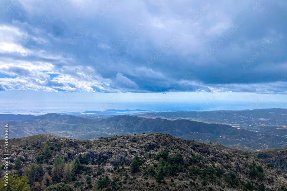 Panoramic view from hiking trail to Maroma peak in thunderstorm day, Sierra Tejeda, Spain 