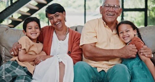 Happy kids, hug or face of grandparents with smile, care or love for support in family home together. Elderly grandma, laughing or children siblings on sofa with grandfather to relax in retirement photo