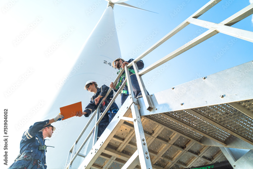 engineer working in fieldwork outdoor. Technicians of wind turbine checking and maintenance Electricity wind generator.. operation of wind turbines that converts wind energy into electrical energy