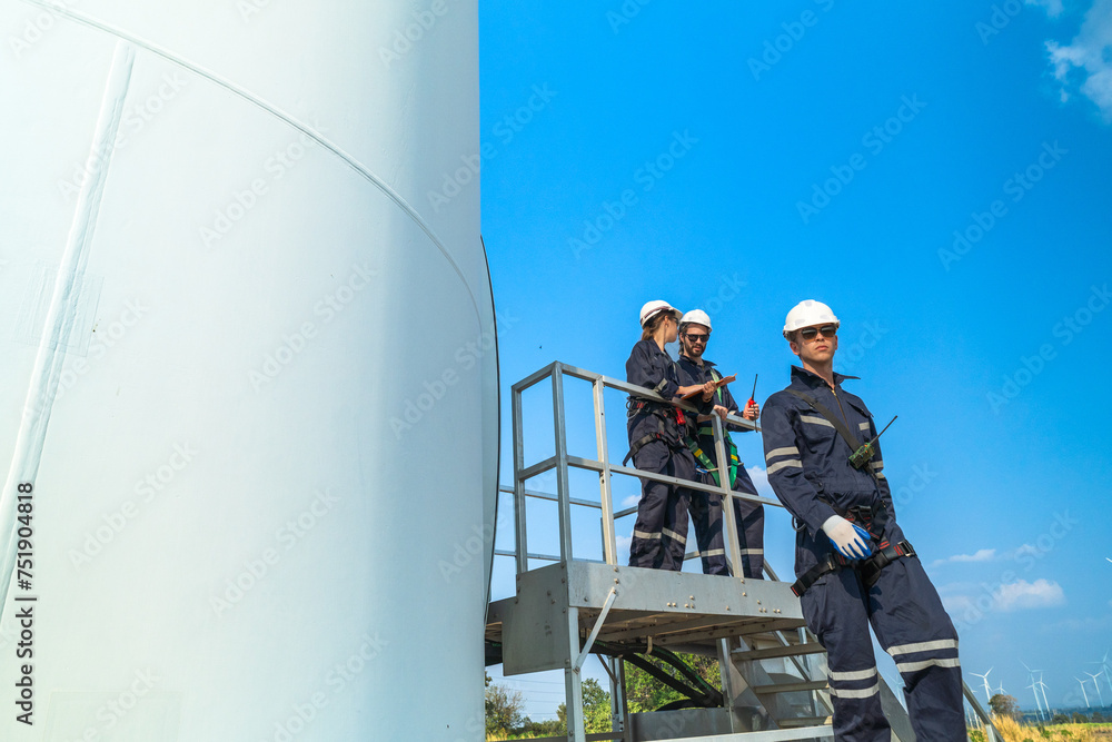 engineer working in fieldwork outdoor. Technicians of wind turbine checking and maintenance Electricity wind generator.. operation of wind turbines that converts wind energy into electrical energy engineer working in fieldwork outdoor. Technicians of wind turbine checking and maintenance Electricity wind generator.. operation of wind turbines that converts wind energy into electrical energy