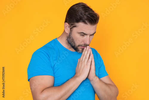 Man praying. Isolated portrait of male pray. Christian man hand praying, spirituality and religion, man praying to god. Christianity concept.